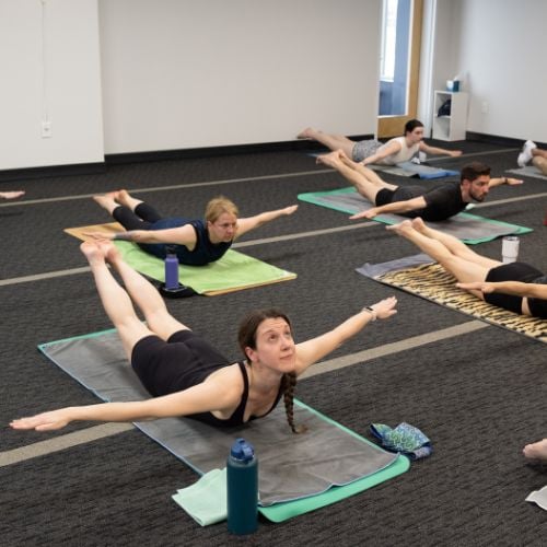 a group of student in yoga class