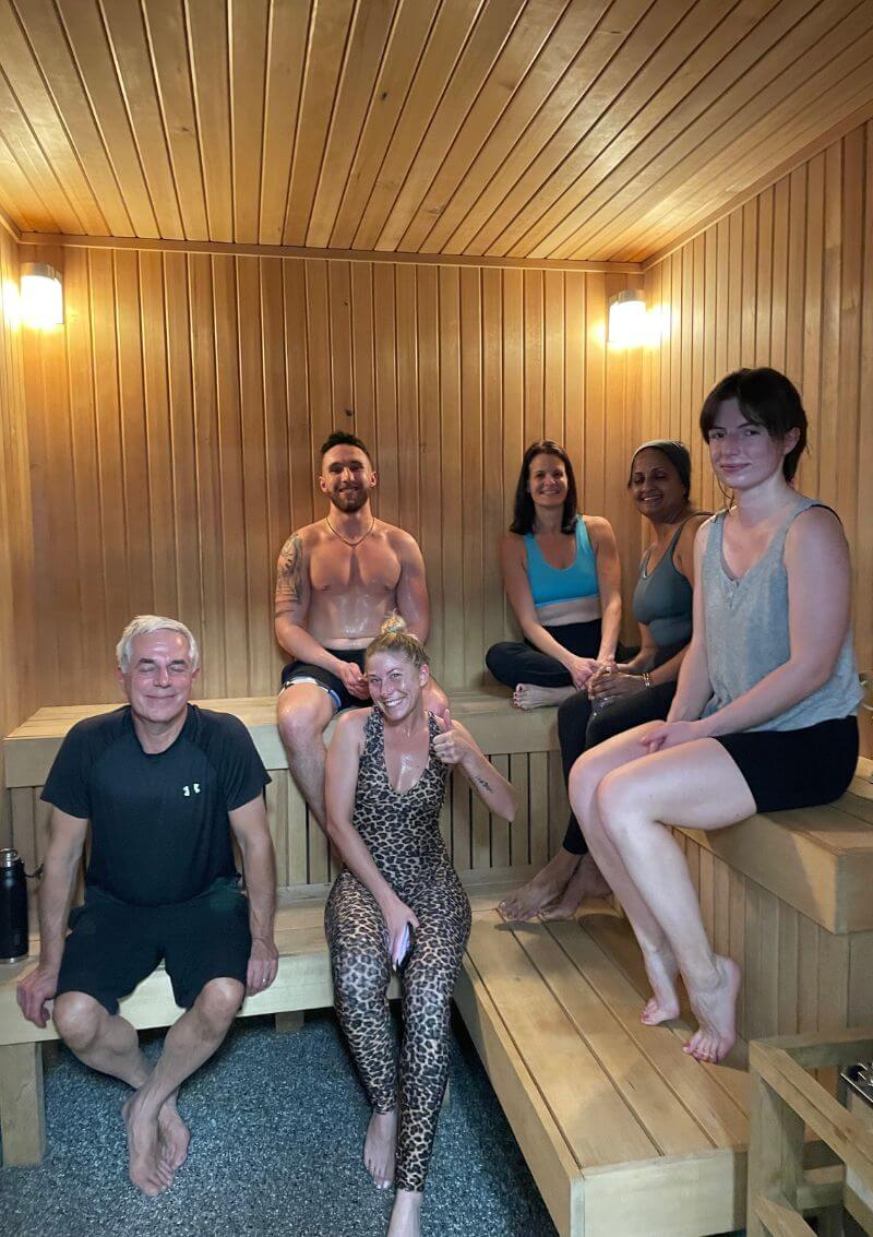 a group of people in a co-ed sauna