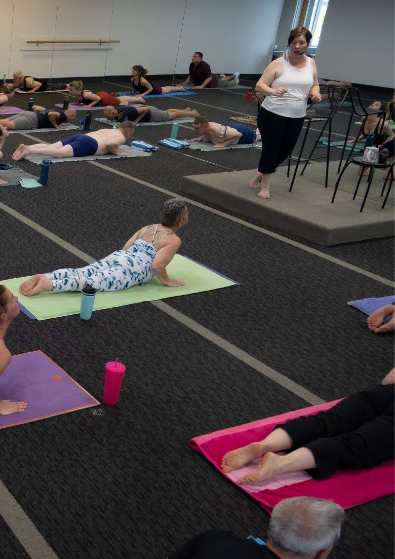 Teri instructing a group yoga class
