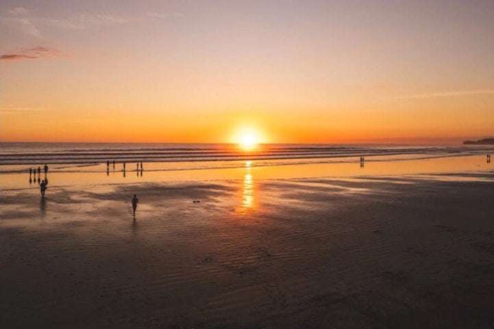a sunset over a beach
