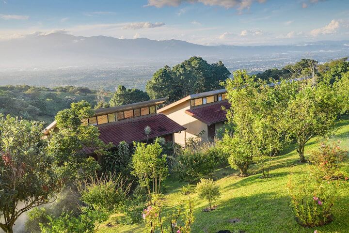 a house surrounded by greenery and trees
